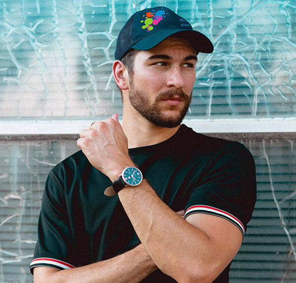 Man wearing a black starter pack hat and a black t-shirt
